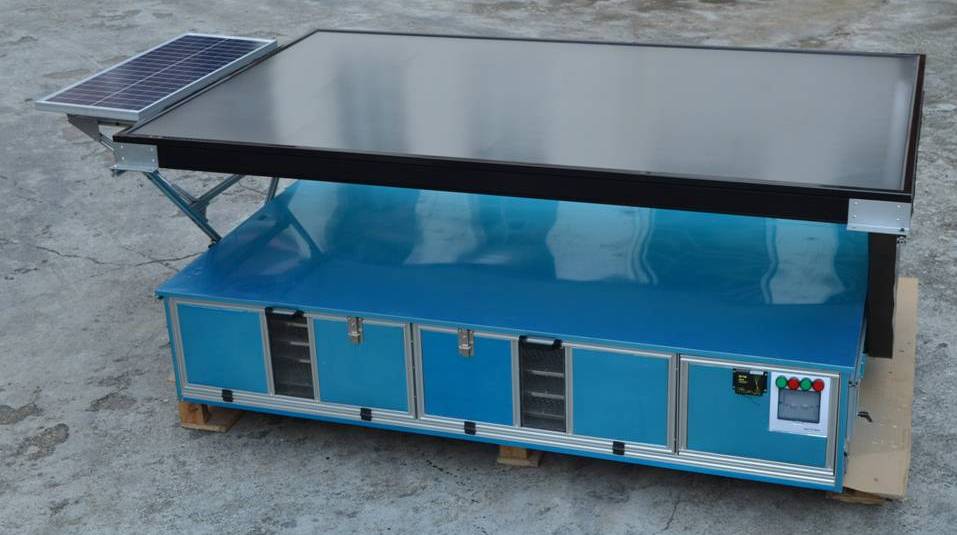 Loading side of the cabinet showing aluminum trays.
